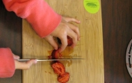 Cutting strawberries.