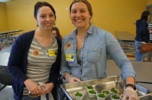 Growing Minds Interns Kristen and Lizzie at Mills River Elementary serving kale and sweet potato salad
